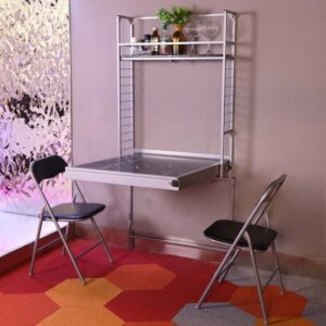 404726_b_1.jpg שולחן מתקפל לקיר כולל זוג כסאות ומדף אחסון דגם Accord מבית Bradex - צבע כסוף